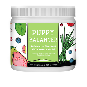 150g Jar of 'Puppy Balancer' vitamins and minerals with a colorful label on a white background